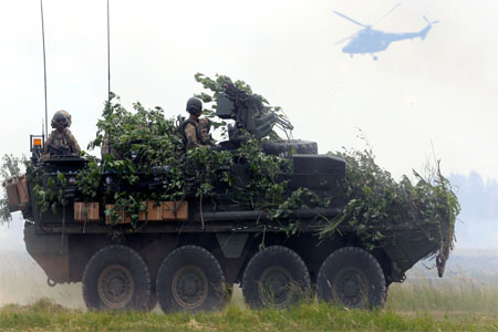 U.S. army soldiers with their Stryker armoured fighting vehicle attend the final day of NATO Saber Strike exercises in Orzysz, Poland, June 16, 2017.