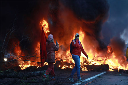 Members of Brazil's Homeless Workers Movement (MTST) block a highway during the general strike in Eldorado do Sul, Rio Grande do Sul state, Brazil June 30, 2017