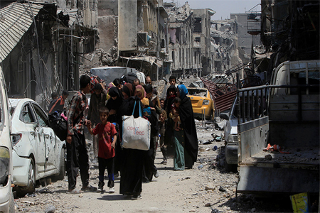 Displaced Iraqi civilians flee from clashes in the Old City of Mosul, Iraq, July 1, 2017