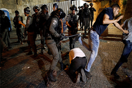 Israeli border police clash with Palestinian men outside the Lion's Gate of Jerusalem's Old City July 18, 2017