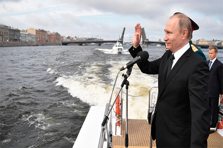 Vladimir Putin inspects ships lined up in the Neva waters for the Main Naval Parade marking Navy Day, St. Petersburg