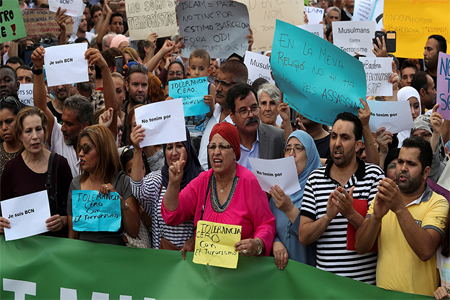 Muslims shout slogans as they gather at Plaza Catalunya to protest against terrorism in Barcelona, Spain August 21, 2017