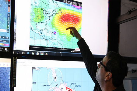 A member of the Emergency Operations Committee (COE) monitors the trajectory of Hurricane Irma in Santo Domingo, Dominican Republic, September 6, 2017.