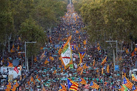 People wave Catalan separatist flags during a demonstration organised by Catalan pro-independence movements ANC (Catalan National Assembly) and Omnium Cutural, following the imprisonment of their two leaders Jordi Sanchez and Jordi Cuixart, in Barcelona
