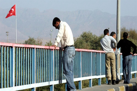 Truck drivers are seen as they wait to cross the Iraqi-Turkish border at the Ibrahim al-Khalil crossing, some 475 kilometers (300 miles) northwest of Baghdad, Iraq.