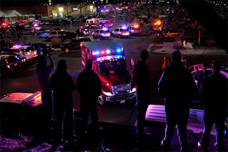 People watch an ambulance leave at the scene of a shooting at a Walmart in Thornton, Colorado November 1, 2017.