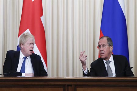 Russian Foreign Minister Sergei Lavrov and British Foreign Secretary Boris Johnson attend news conference.