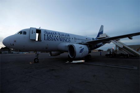 A plane, that was damaged during clashes, is seen at Mitiga airport in Tripoli on January 15, 2018