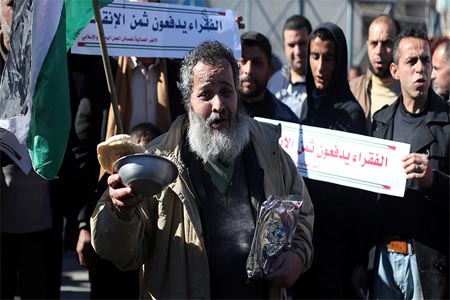 Palestinians take part in a protest calling for better living conditions for people outside the United Nations Relief and Works Agency (UNRWA) office, in Rafah in the southern Gaza Strip January 11, 2018