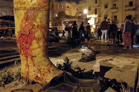 Pictures emerged appearing to show at least nine prisoners being shot dead at the site of a twin car bombing. (Supplied)