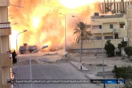 This photo posted on a file sharing website Wednesday, Jan. 11, 2017, by ISIS in Sinai shows an explosion as militants attack an Egyptian police checkpoint on Monday, Jan. 9, 2017, in el-Arish, north Sinai, Egypt (File
