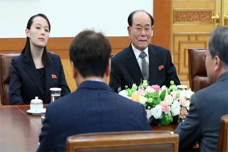 South Korea's President Moon Jae-in talks with Kim Yo Jong, North Korean leader Kim Jong Un's sister, and North Korea's ceremonial head of state Kim Yong Nam, February 10, 2018.