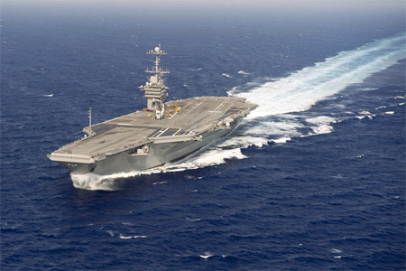 The aircraft carrier USS Harry S. Truman performs a full power run during sea trials in the Atlantic Ocean