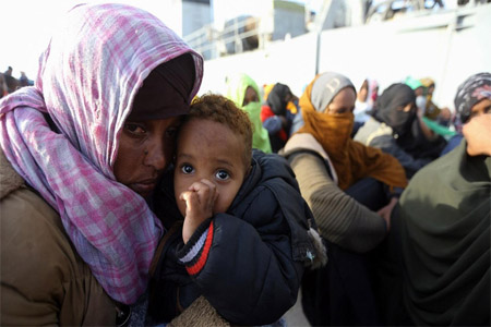 Illegal migrants of different African nationalities arrive at a naval base in the capital Tripoli on April 22, 2018, after they were rescued off the coast of Zlitan from two inflatable boats