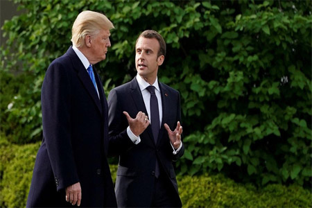 U.S. President Donald Trump and French President Emmanuel Macron walk from the Oval Office of the White House.