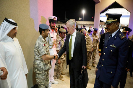 U.S. Defense Secretary James Mattis (C) is greeted by military dignitaries as he arrives at Al Udeid Air Base in Doha, Qatar April 21, 2017.