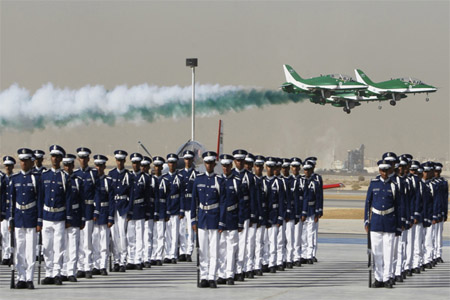 Royal Saudi Air Force jets fly in formation during a graduation ceremony for air force officers at King Faisal Air Academy in Riyadh January 1, 2013.
