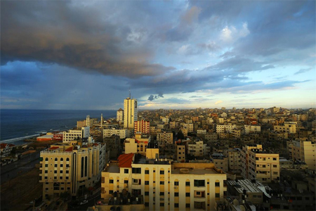 A picture taken on January 3, 2017, shows the skyline of Gaza City during the sunset.