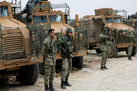 Turkish forces are seen near Mount Barsaya, northeast of Afrin, Syria.
