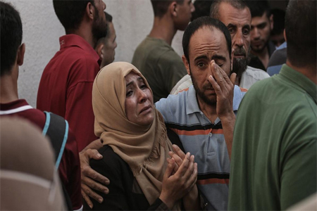 Palestinian relatives of Mohammed al-Radeia, 30, mourn during to his funeral in Beit Lahia in the northern Gaza Strip