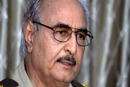 In this Saturday, May 17, 2014 photo, Libyan Gen. Khalifa Haftar addresses a press conference in Benghazi, Libya