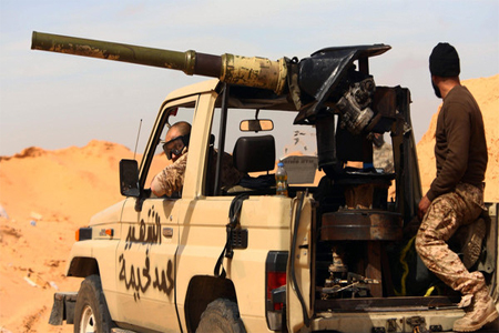 Fighters from the Fajr Libya (Libya Dawn), an alliance of Islamist-backed militias, take position in Bir al-Ghanam, around 50 kilometers (30 miles) from the capital, on March 5, 2015. (Reuters)
