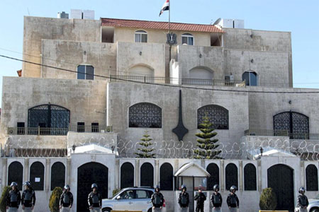 Jordanian riot policemen stand guard outside the Syrian embassy in Amman on December 2, 2011 during a demonstration by Syrians living in Jordan against the Syrian regime and its deadly crackdown on dissidents. AFP