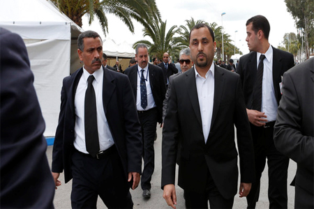 Dr. Saleh Almkhozom, Second Deputy Chairman of the Libyan General National Congress, walks escorted by bodyguards outside the Palais des Congress of Skhirate 30 km south of Rabat, Morocco, Friday, March 20, 2015. (File: AP)