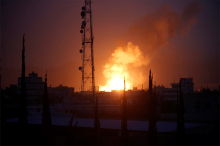 Fire and smoke rises after a Saudi-led airstrike hit a site believed to be one of the largest weapons depot on the outskirts of Yemen's capital, Sanaa, on Wednesday, June 3, 2015. (AP)