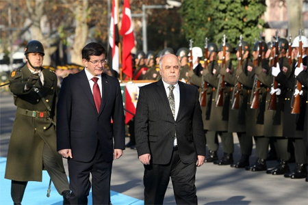 AFP حيدر العبادي وداود أوغلو