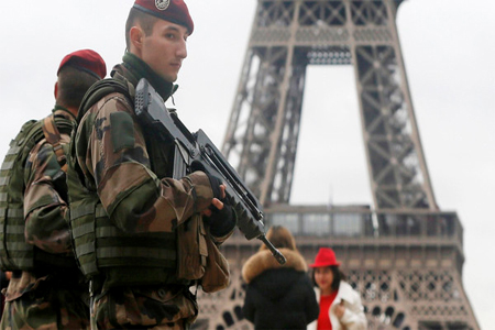 French soldier patrol near the Eiffel Tower in Paris as part of the highest level of "Vigipirate" security plan after a shooting at the Paris offices of Charlie Hebdo Jan. 9, 2015. (Reuters)