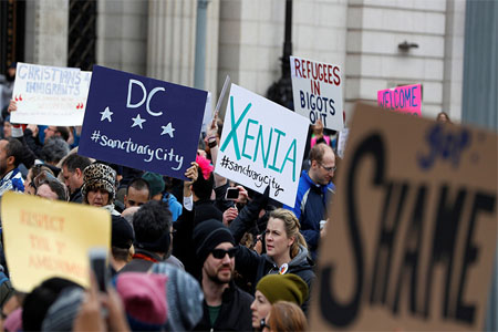 Activists gather outside the White House to protest President Donald Trump's executive actions on immigration