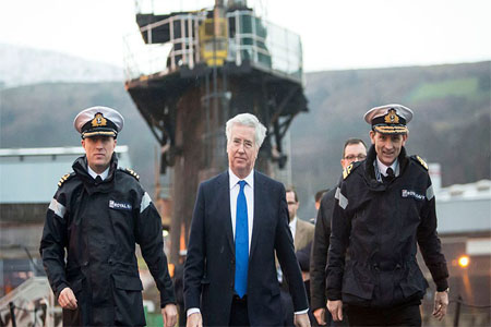 Defence Secretary Michael Fallon (C) onboard HMS Vigilant in Rhu, Scotland, January 21, 2016