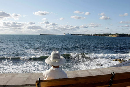 A woman sits at the embankment in the Black Sea city of Sevastopol, Crimea